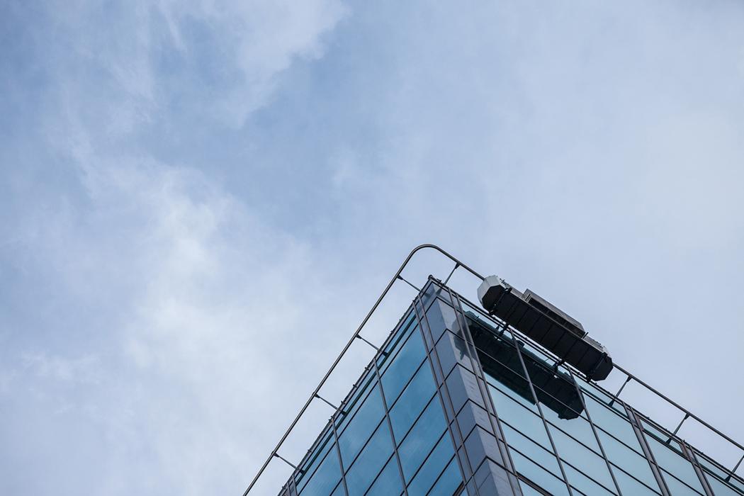 Window cleaning platform at the top of a high-rise office building.