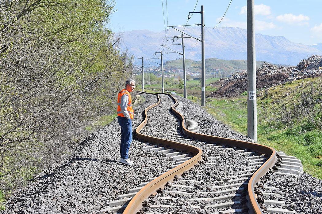 Principal Kerem Gulec inspects the significant surface displacement of a railroad track in Golbasi.