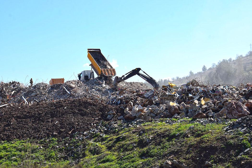 One of the many piles of debris from collapsed and demolished buildings.