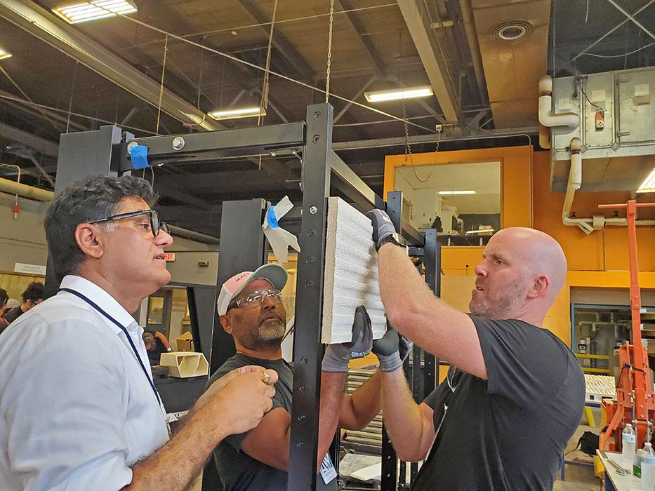 Sanjeev Tankha (left) of STARQ Design inc., one of the workshop’s organizers, Thornton Tomasetti’s Vishwadeep Deo and Christopher Dial of Henning Larsen assemble the rainscreen system.