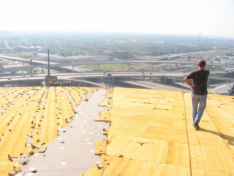 Assessing roof damage from Hurricane Katrina in New Orleans, Louisiana. 
