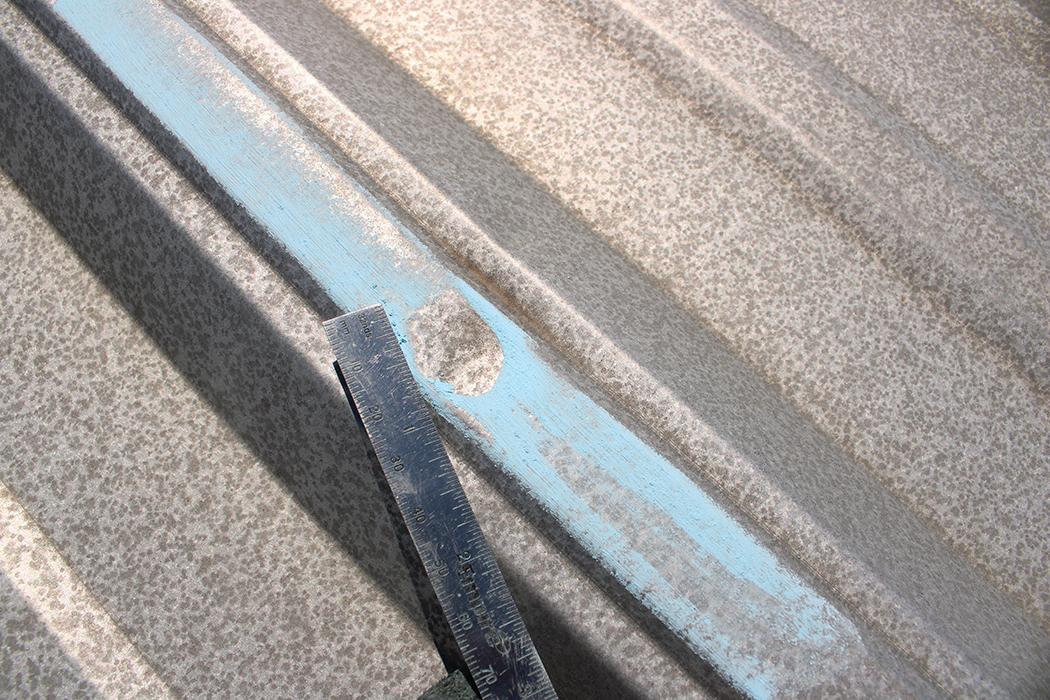 Hail impact on metal panel roofing.