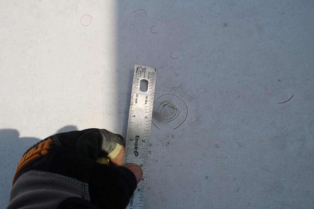 Hail impact on single ply PVC.