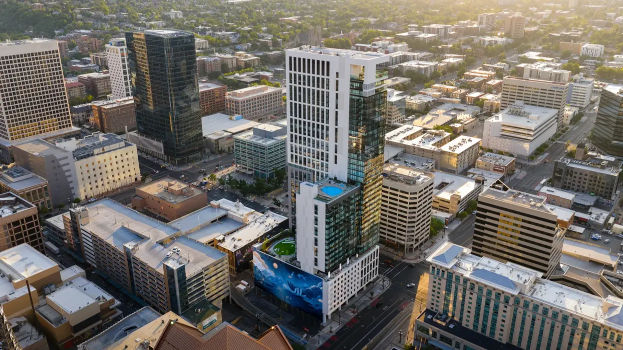 The tower’s western facade features a 13,000-square-foot monumental mural by artists Joseph Toney and Miles Toland celebrating the state’s culture and natural beauty.