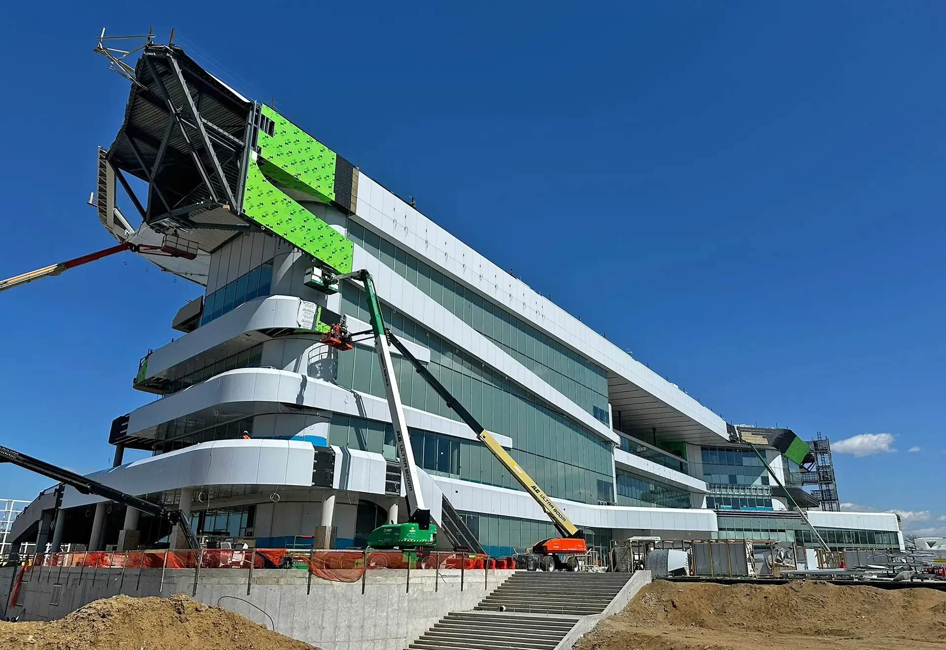 The project team reused portions of the 1960s building’s foundations to reduce demolition and environmental impacts, and the smaller building footprint supports the park’s role as a community and racing hub while respecting its historical significance.
