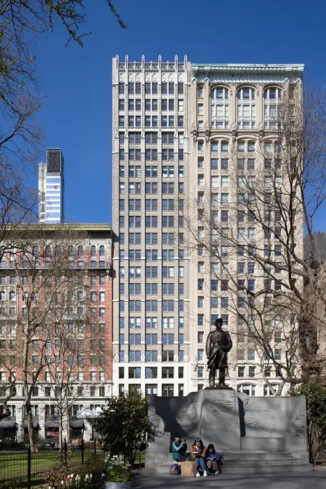 The owner’s vision was to reposition two adjacent historic office buildings as a unified, inviting commercial destination while both towers remained open for business. 