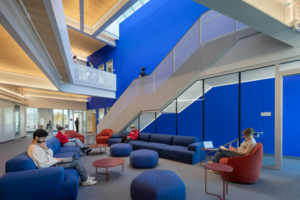 The two wings of the building that will contain academic research offices and computational labs are joined by a suite of collaborative spaces on each of their upper floors.