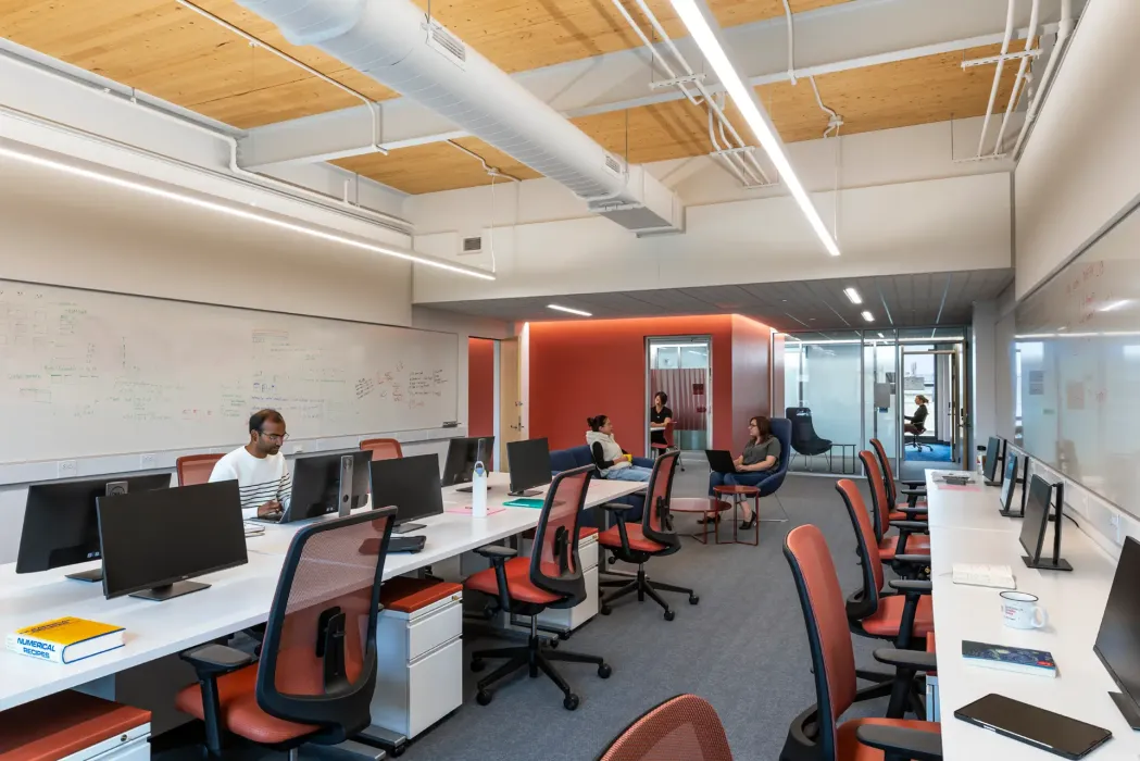 The building structure is an innovative hybrid steel-mass timber system utilizing CLT floor slabs on the third and fourth floors and the roof that are supported by steel framing.