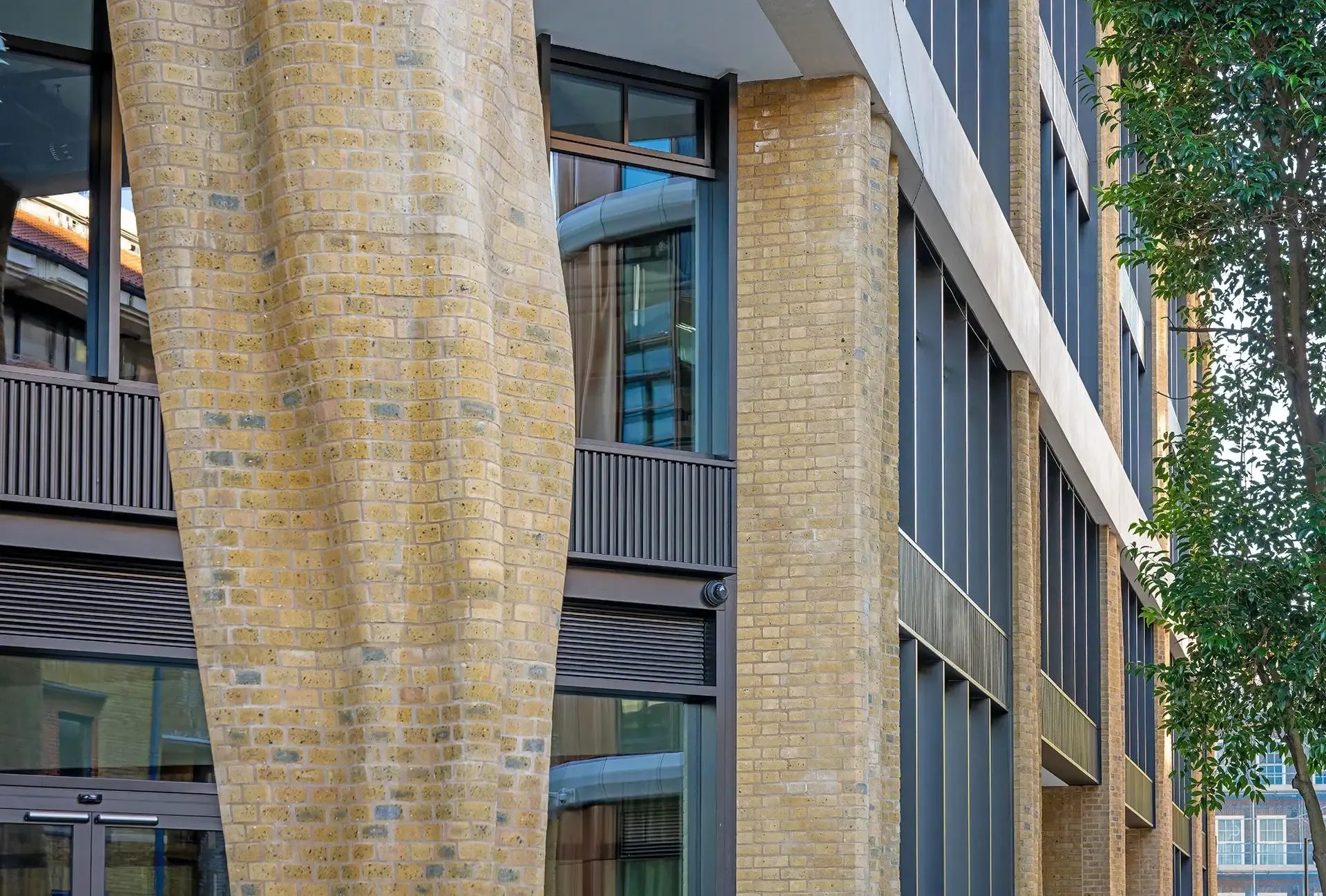 Brick-faced precast and high-performance glazing work together to create a robust, weathertight enclosure that supports thermal efficiency, daylighting, solar control, acoustic comfort, and long-term durability. 