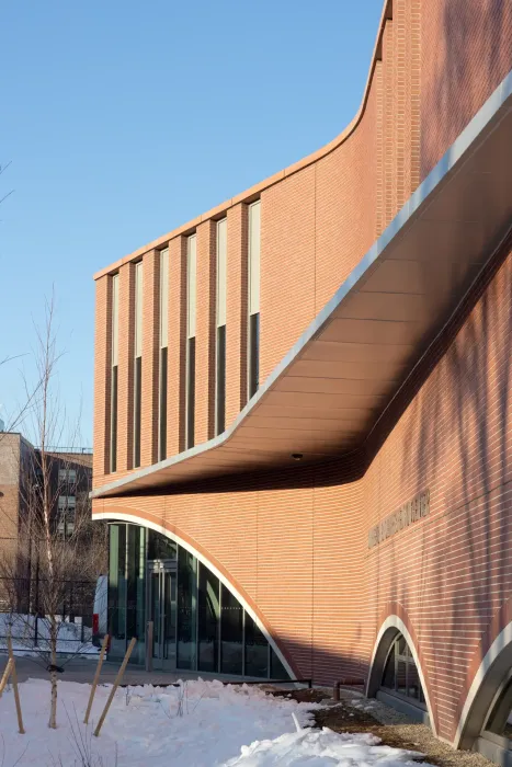 The lower two levels of the building are clad in large, brick-faced architectural precast panels that were prefabricated off-site. 