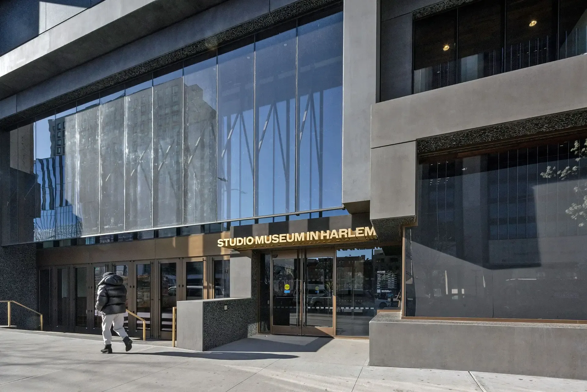 The building’s sculpted precast-concrete and glass façade takes cues from the scale and rhythm of neighboring brownstones without imitating them. 