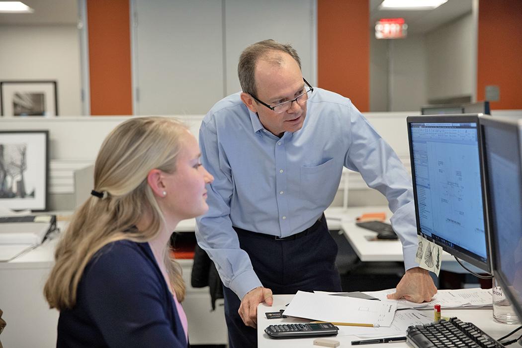 Colleen Harper and President Wayne Stocks working in the Washington, D.C. office in 2020.