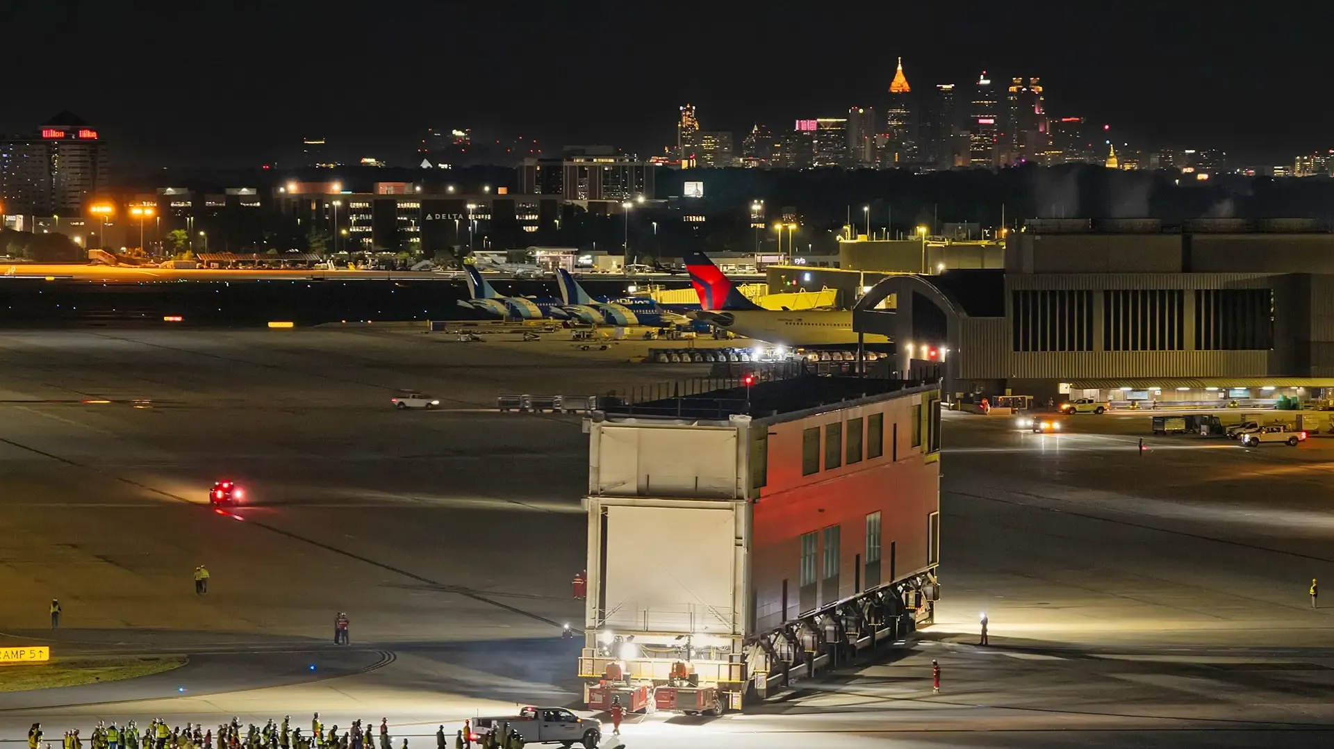 During the initial phases, prefabricated large-format modules (LMFs) were assembled off-site and transported overnight to the east side of the concourse. 