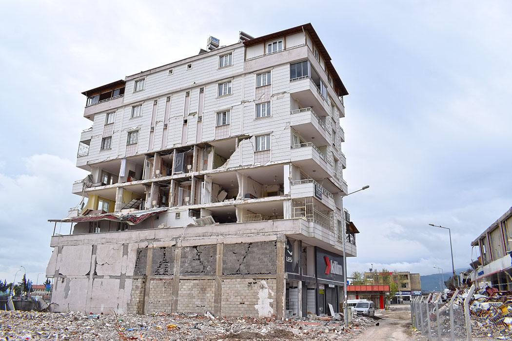 Typical pathology of modern reinforced concrete building with heavy damage to infill walls.