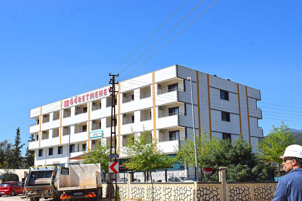 A post-2000 government building with minimal structural damage and still operational.